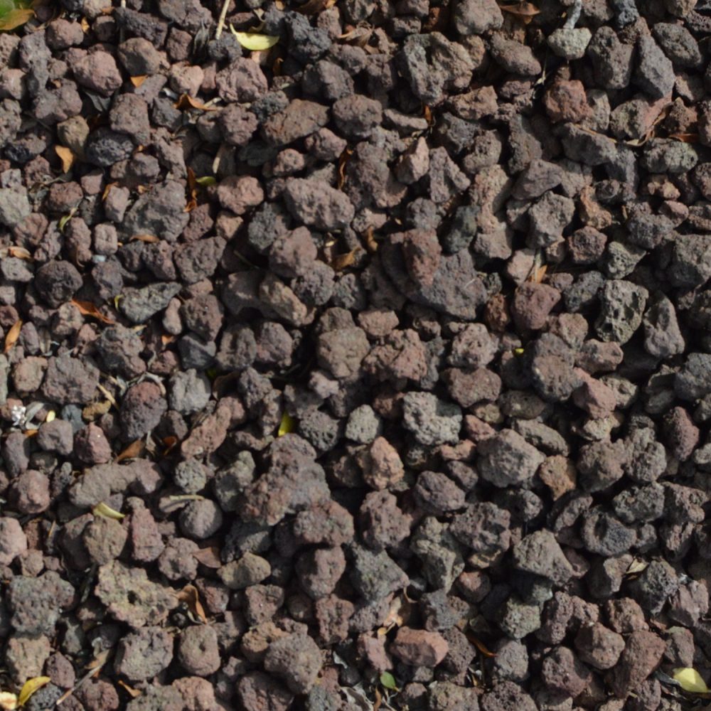 Zoom sur matériaux en pouzzolane rouge.